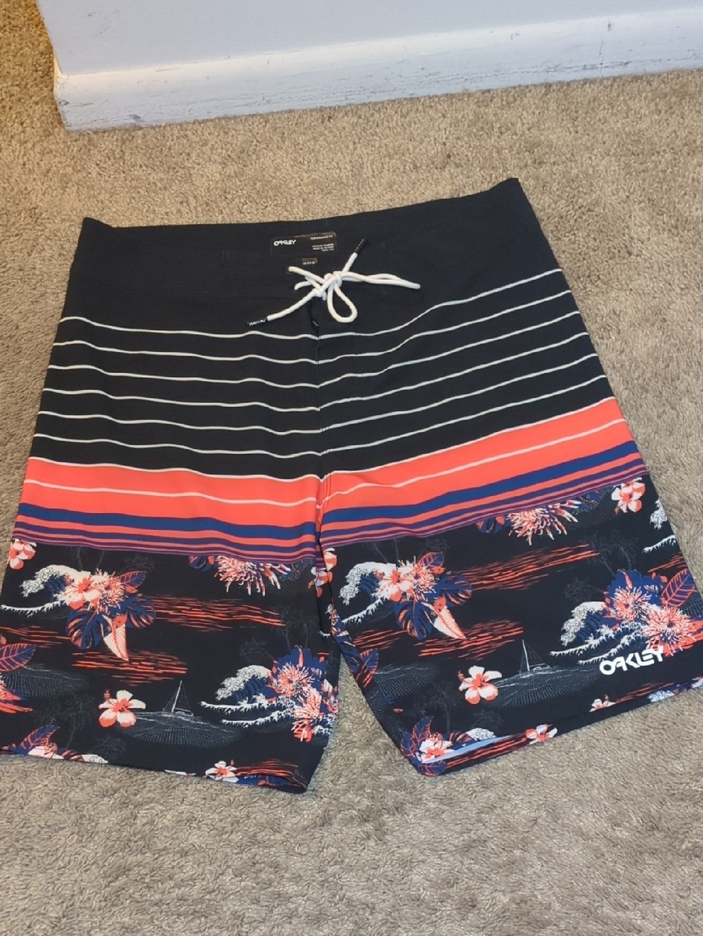 Two (2) Oakley Men’s Black Swim Shorts with Coral & Navy Floral Stripe